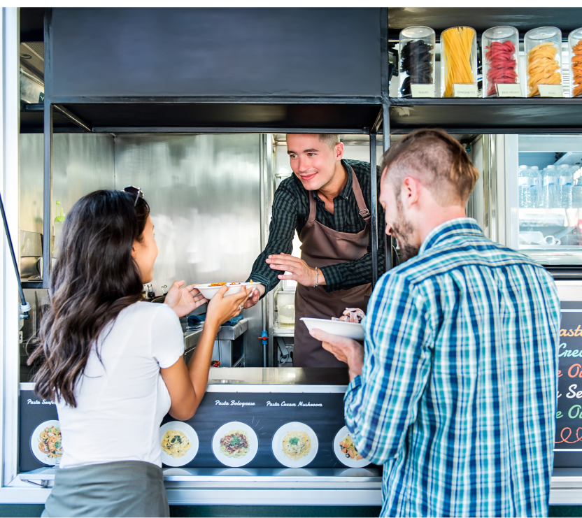 people getting food from a food truck